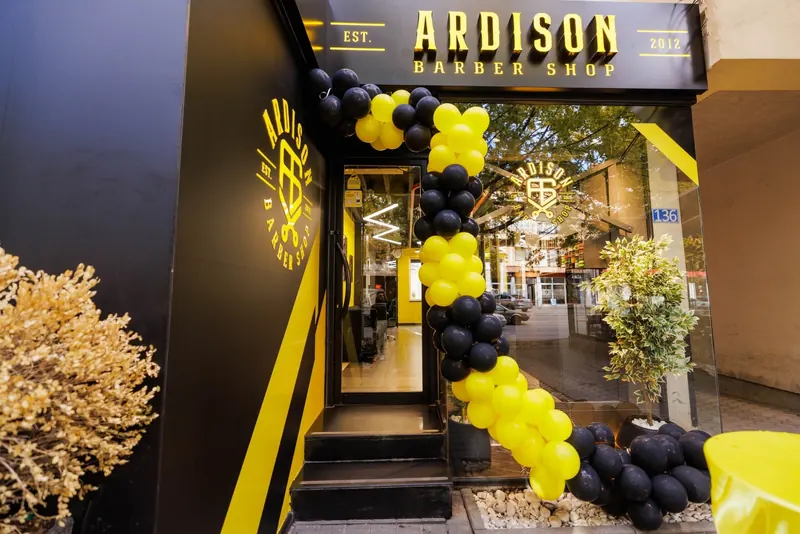 The shop entrance framed by black and yellow balloons